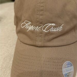 Baseball cap with airport crush on front